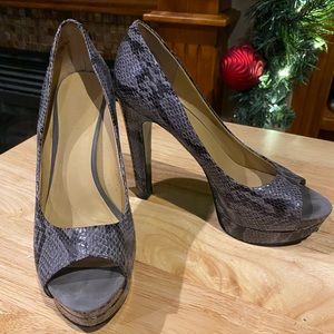 Nine West gray snakeskin platform pump.